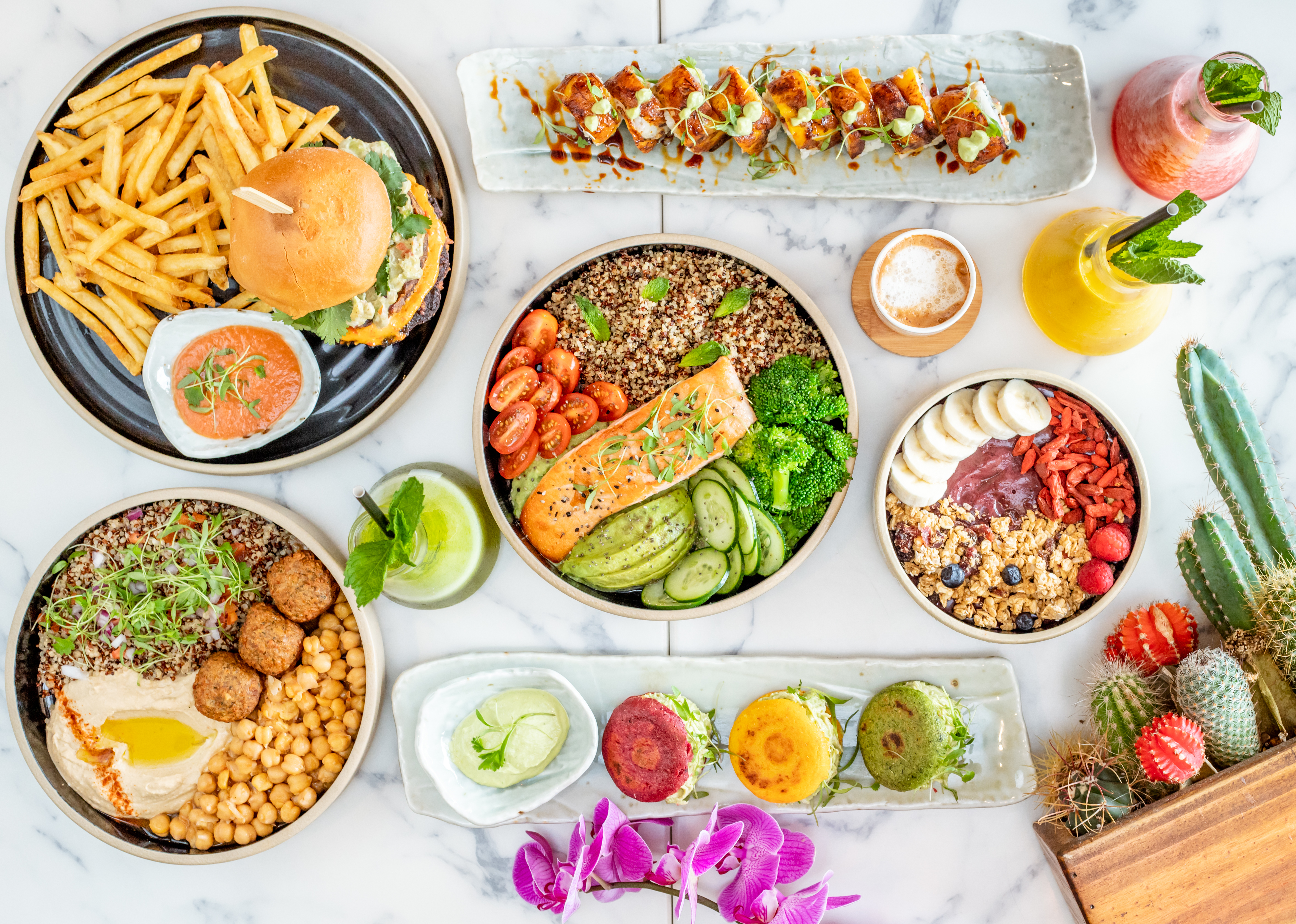 Top view of various tasty dishes next to plants